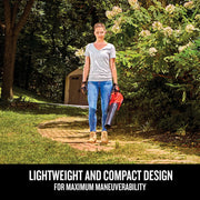 Photo of person holding Craftsman cordless leaf blower CMCBL700B in a garden, showcasing lightweight, compact design.