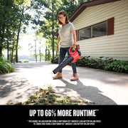 Photo of Craftsman cordless blower CMCBL730P1 clearing leaves on a driveway near a house, outdoor setting.