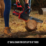 CRAFTSMAN CMCCS620M1 cordless chainsaw cutting wood outdoors, 12-inch bar shown.
