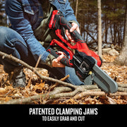 Photo of Craftsman cordless chainsaw CMCCSL621B with patented clamping jaws cutting tree branches outdoors.
