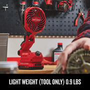 Photo of Craftsman red cordless jobsite fan CMCE010B on a workbench, adjustable head, workshop background.