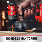 Photo of Craftsman CMCF813C1 impact driver in use, red and black, driving a screw into wood, close-up view.