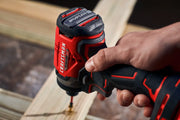 Photo of a Craftsman cordless impact driver, SKU CMCF813C2, in use driving a screw into wood, close-up angle.