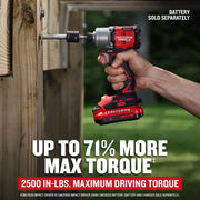 Photo of Craftsman CMCF830B impact driver in use driving a large screw into wood, shown with battery attached.