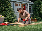 Photo of Craftsman cordless impact driver, SKU CMCF921B, in use driving a bolt into wood, handheld close-up.
