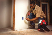 Photo of Craftsman work light SKU CMCL030B illuminating a worker installing drywall wiring in construction.