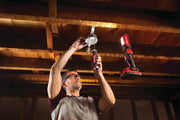 Photo of Craftsman work light CMCL050B illuminating ceiling wiring installation, construction context.