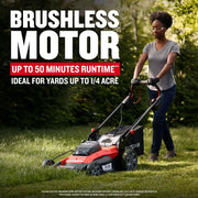 Photo of a person mowing grass with a Craftsman CMCMWSP220P2 cordless lawn mower, red and black, outdoors.