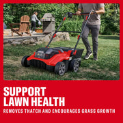 Photo of Craftsman lawn dethatcher CMCOE210P2 on grass with person pushing, outdoor setting in background.