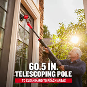 Photo of CRAFTSMAN CMCPS520B graphics category, person using a red and black telescoping pole brush to clean an exterior window.