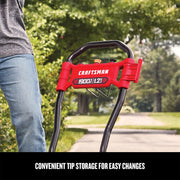 Photo of Craftsman CMEPW1900 pressure washer handle with red tip storage feature, shown outdoors on a driveway.
