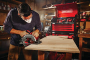 Photo of Craftsman circular saw CMES510 in use cutting wood in workshop with Craftsman tool chest in background.