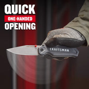 Photo of a gloved hand opening a CRAFTSMAN folding knife, SKU CMHT10354, with quick one-handed opening feature.