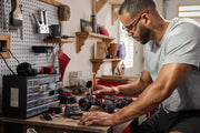 Photo of CRAFTSMAN CMHT66720 hand tool used on RC car, workshop setting with pegboard and storage drawers.