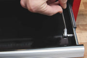 Photo of CRAFTSMAN ratcheting wrench, SKU CMHT68008, tightening a bolt inside a toolbox drawer, close-up angle.