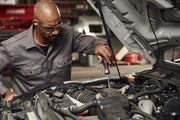 Photo of mechanic using Craftsman screwdriver CMHT68142V to service car engine in workshop.