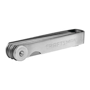 Photo of Craftsman CMMT14105 stainless steel feeler gauge set on white background, side view.