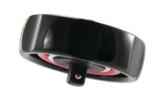 Photo of Craftsman CMMT86004 ratchet, black and red circular tool, angled view on white background.