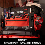 Craftsman tool bag CMST17622 with red and black fabric, front pockets, and tools, shown at an angle.