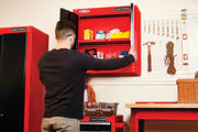 Photo of Craftsman wall cabinet SKU CMST22800RB open, displaying tools and storage in a workshop setting.