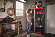 CRAFTSMAN CMST24800RB storage cabinet in a garage, black and red, with open doors and visible shelves.