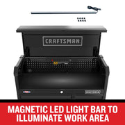 Photo of Craftsman magnetic LED light bar CMST98259BK with USB cord and clips, shown above open black tool chest work area.