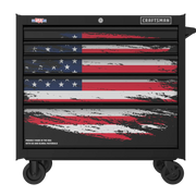Rolling tool chest with four drawers, decorated with a distressed American flag design on the front. It features brand logos and text indicating it is made in the USA with US and global materials.