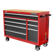 A red Craftsman rolling tool chest with multiple black drawers and a wooden top, equipped with wheels and a side handle.