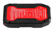 Photo of CRAFTSMAN CMXCESM264 lithium jump starter, black and red, top view showing instructions and caution label.