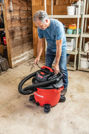 Photo of Craftsman wet/dry vacuum CMXEVBE17595 in use in a garage, red and black, large hose visible.