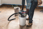 Photo of CRAFTSMAN wet/dry vacuum CMXEVBE17678 placed on a white bucket during use at a construction site.