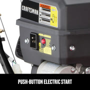 Photo of Craftsman engine with visible electric start button, warning labels, and wiring, CMXGBAM1054546, close-up angle.
