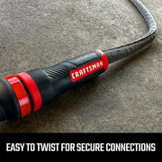 Craftsman hose connector CMXMHBB16549 in black and red, close-up view on gray surface.
