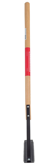 A long-handled tool with a wooden shaft and a metal head featuring a row of teeth, likely used for grooming a baseball field or similar outdoor surface.