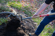 Photo of Craftsman garden fork SKU CMXMLTP35325 used to turn soil in a garden.