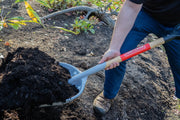 Photo of Craftsman shovel CMXMLTP35332 with wood handle scooping soil outdoors.
