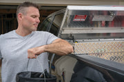Photo of CRAFTSMAN truck toolbox SKU CMXTBAK1000901 in open position, diamond plate finish, mounted on pickup.