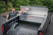 Photo of Craftsman truck bed toolbox CMXTBAK1000901 open in a pickup, diamond plate aluminum finish, angled view.