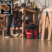Photo of CRAFTSMAN wet/dry vacuum CMXZVBE27151 in a workshop setting near a wooden workbench.