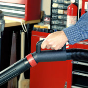 Photo of CRAFTSMAN vacuum hose with handle, model CMXZVBE38639, held in a workshop setting.