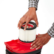 Photo of Craftsman CMXZVBE38752 vacuum filter being installed in a red and black vacuum base, frontal angle.
