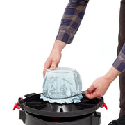 Photo of CRAFTSMAN vacuum filter installation, model CMXZVBE38766, with hands fitting the filter on a black canister.