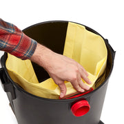 Photo of a hand installing a yellow vacuum filter bag inside a Craftsman wet/dry vacuum, SKU CMXZVBE38775, top view.