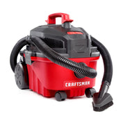 Photo of Craftsman wet/dry vacuum CMXZVBE38801 in red and black, angled view, showing hose and brush attachment.