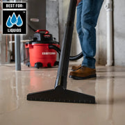 Craftsman wet vacuum CMXZVBE38802 cleaning liquid from floor in basement, close-up on nozzle.